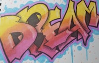 a drawing of graffiti with the word dream on it