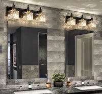 a bathroom with two sinks and a mirror