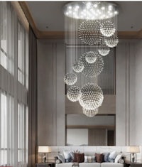 a modern living room with a large chandelier