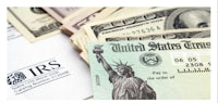 irs forms and money on a table