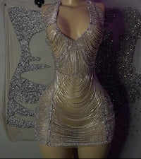 a mannequin dressed in a silver dress